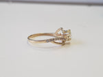 side picture of yellow gold twisted diamond engagement ring